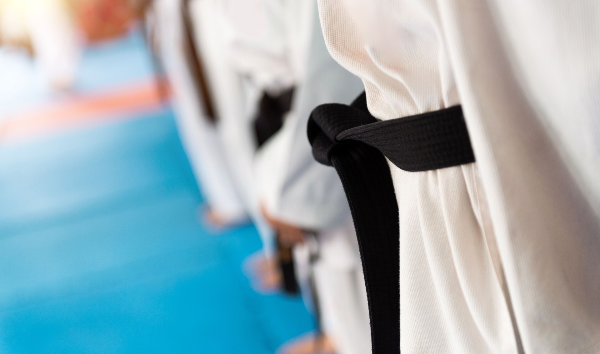 Martial arts athletes in martial arts training exercising Taekwondo